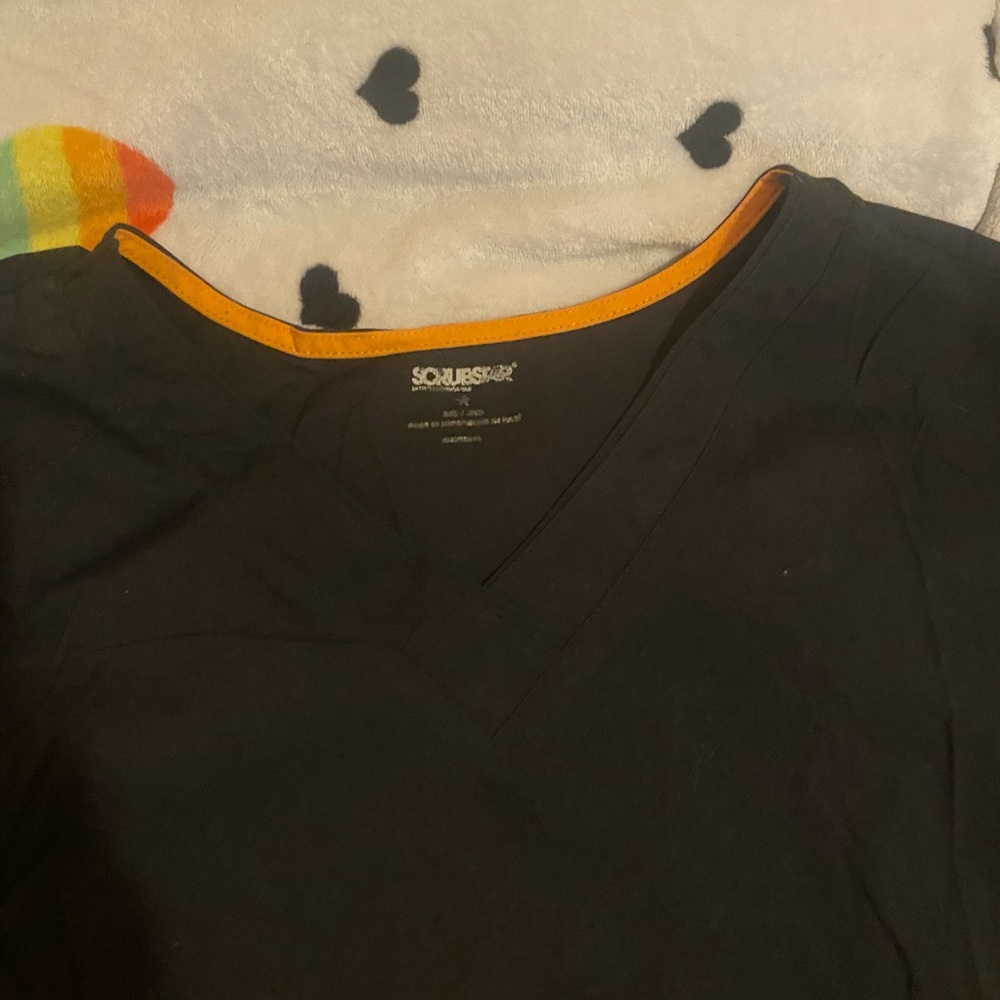 Charcoal V-Neck Scrub Top with Orange Accent and 2 pockets.
